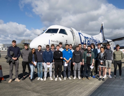 The group of UL students pictured in Shannon with the Flying Classroom plane