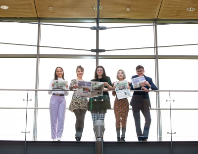 The Limerick Voice editorial team pictured on a balcony in the Glucksman Library at UL
