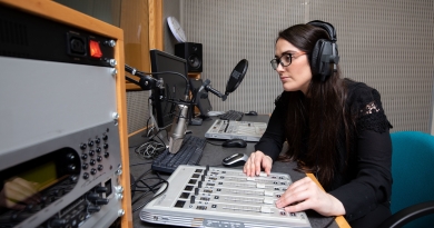 A UL journalism student broadcasting from a media lab