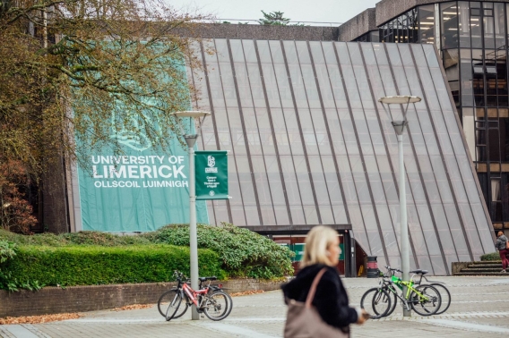 the main building with university of limerick flag