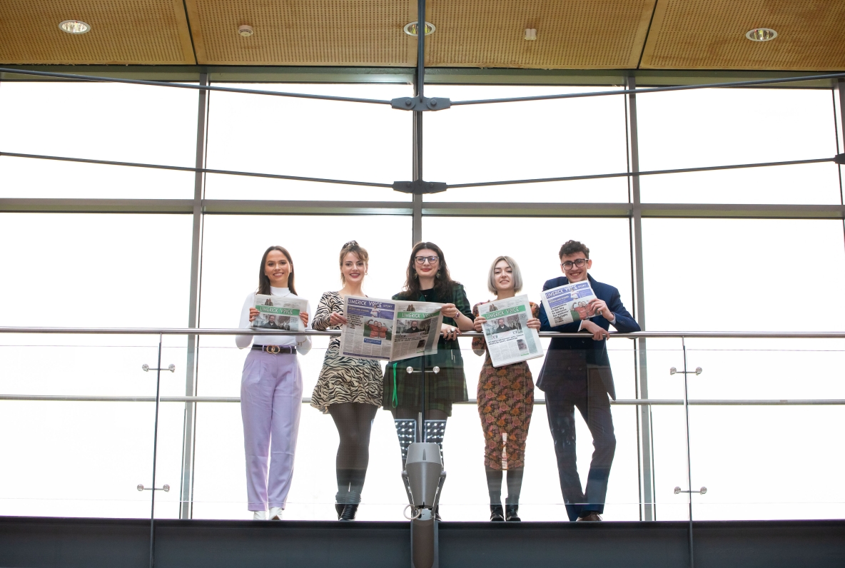 The Limerick Voice editorial team pictured on a balcony in the Glucksman Library at UL