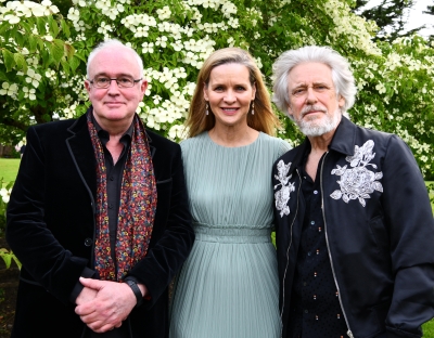 Three people are pictured - a man and two women. It is Professor Joseph O'Connor, Caitríona Fottrell of the Ireland Funds, and Adam Clayton of U2