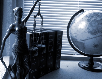 Lady justice with books and globe