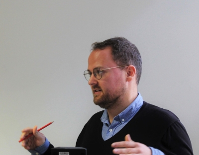 image shows Jonas Hirschi presenting 