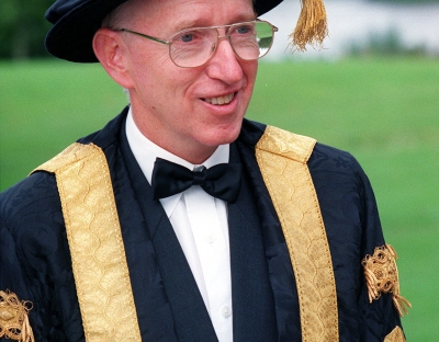 Head and Shoulders photo of Professor Roger Downer in Ceremonial Cap and Gown at UL