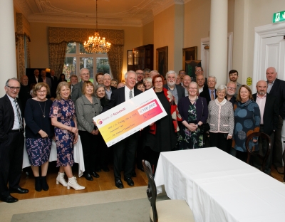 Paddy Meskell holds cheque for €103,000 for Endowment Fund with President Prof. Kerstin Mey before UL founding students
