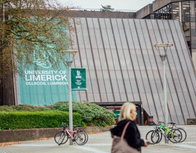 the main building with University of Limerick logo on flag