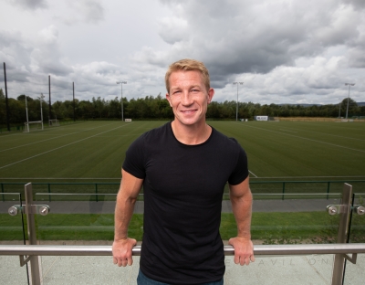 Jerry Flannery standing in front of a rugby pitch