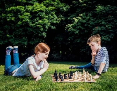 Two kids pictured playing chess at University of Limerick