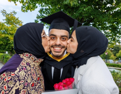 Saleem with his mum and his fiancé pictured after his graduation at UL