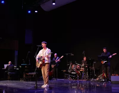 Student from IWAMD performing on stage