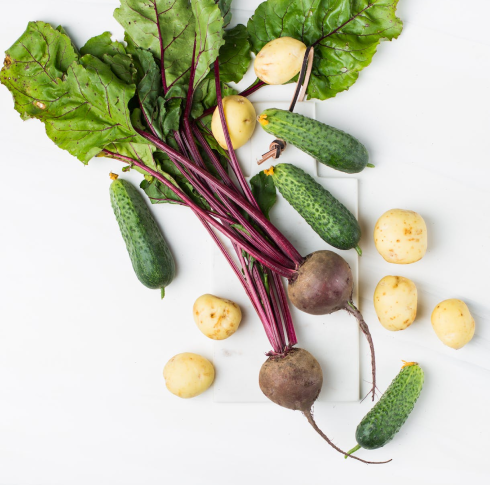 An image of an assortment of vegetables on a white surface