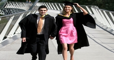 Two graduating students on living bridge