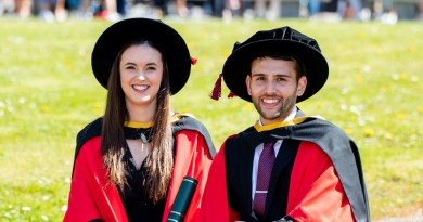 Two smiling PhD graduates following their conferral at the University of Limerick