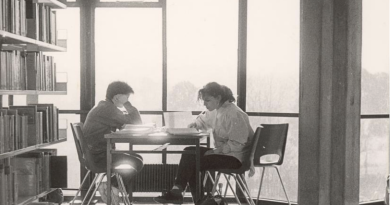 Black and white photo of students studying in the Library