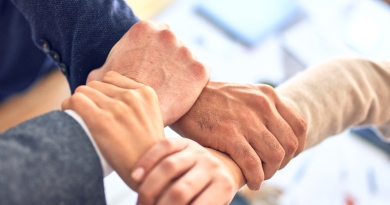 A team of interconnected hands