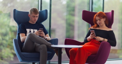 Students on phones in Glucksman library ul campus