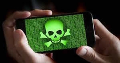 Hands holding a phone with a skull and cross bones on the screen
