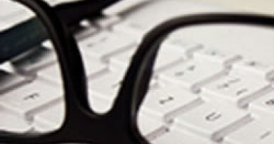glasses on keyboard