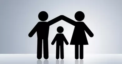 Image of small child protected by two adults