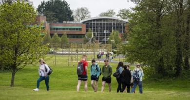 students walking on grass