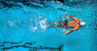 Athlete Swimming in a Pool