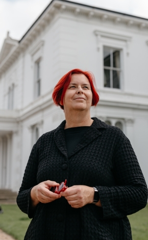 Professor Kerstin Mey in front of the UL White House