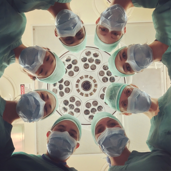 Groups of doctors looking down the camera