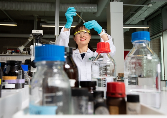 A picture of Dr Xiang Jing at work in a lab