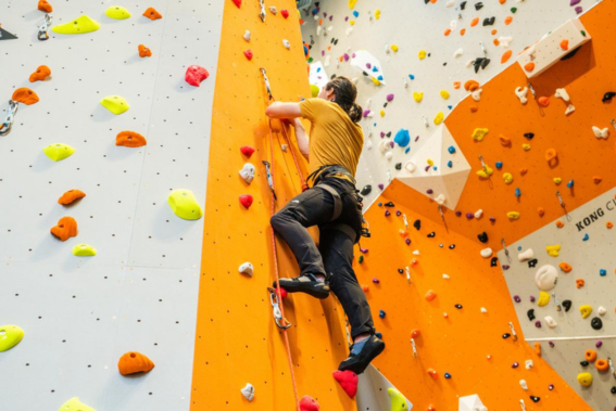 Student using the climbing wall on campus