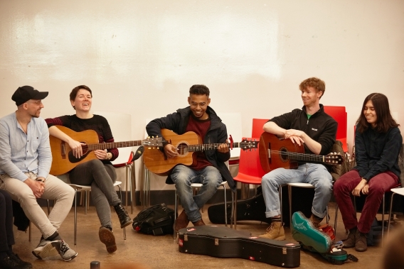 group of people playing different instruments