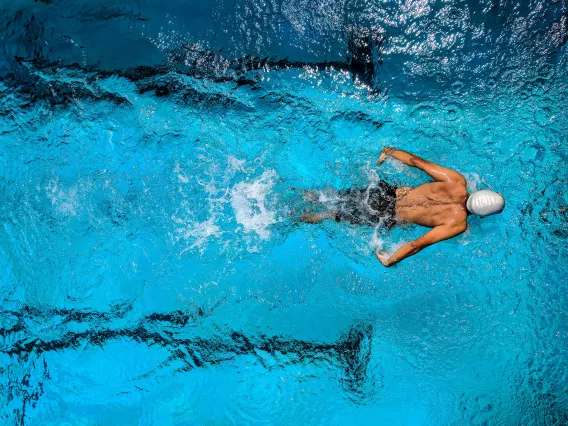 Athlete Swimming in a Pool