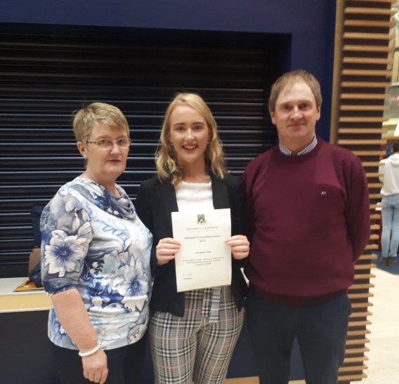 Lisa Daly with her parents Denis and Margaret Daly on receiving a Gold President's Volunteer Award in 2019