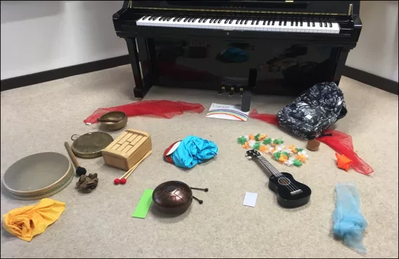 Musical instruments spread across the floor.
