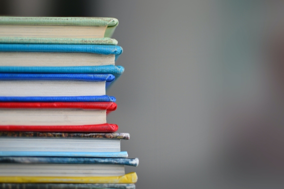 Image shows a stack of books