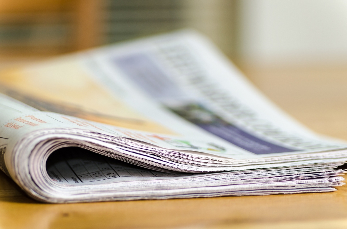 image shows newspapers in a bundle 