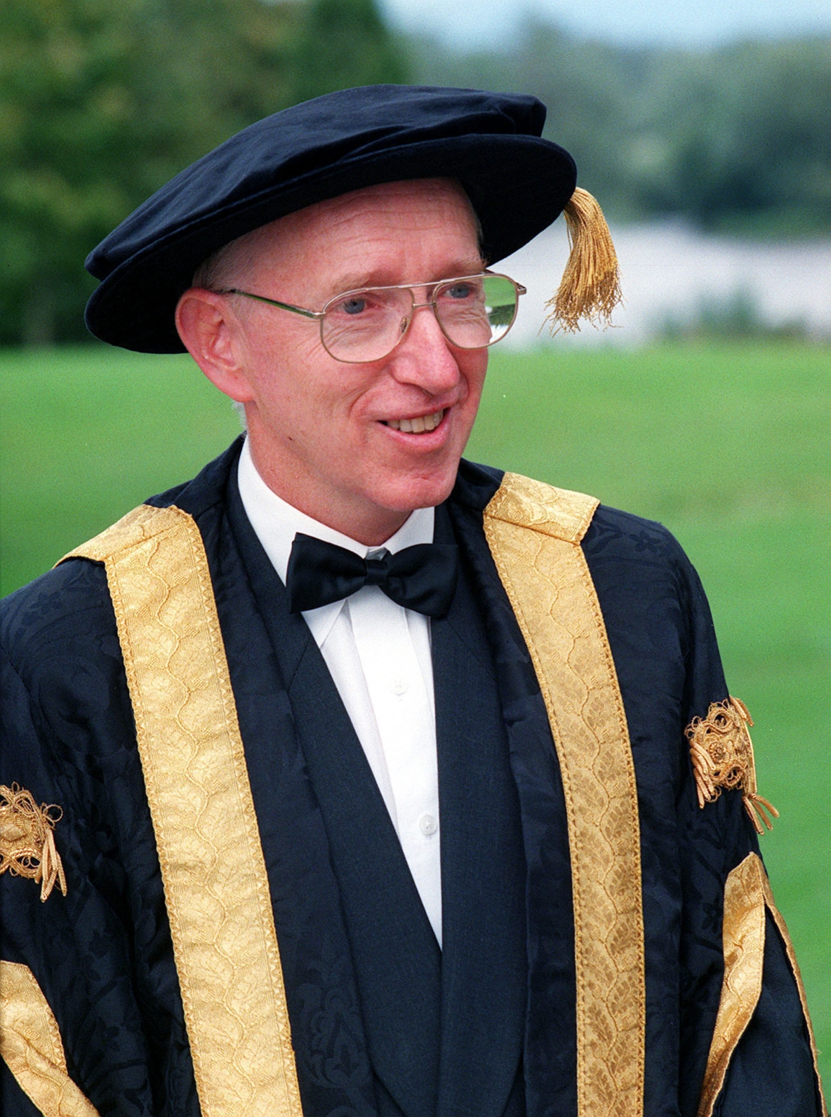 Head and Shoulders photo of Professor Roger Downer in Ceremonial Cap and Gown at UL