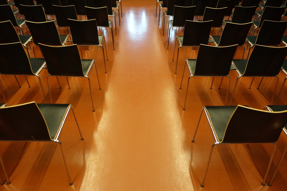 Image shows auditorium of chairs