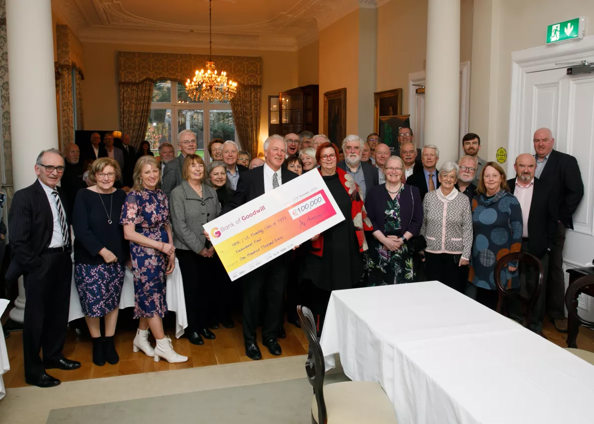 Paddy Meskell holds cheque for €103,000 for Endowment Fund with President Prof. Kerstin Mey before UL founding students