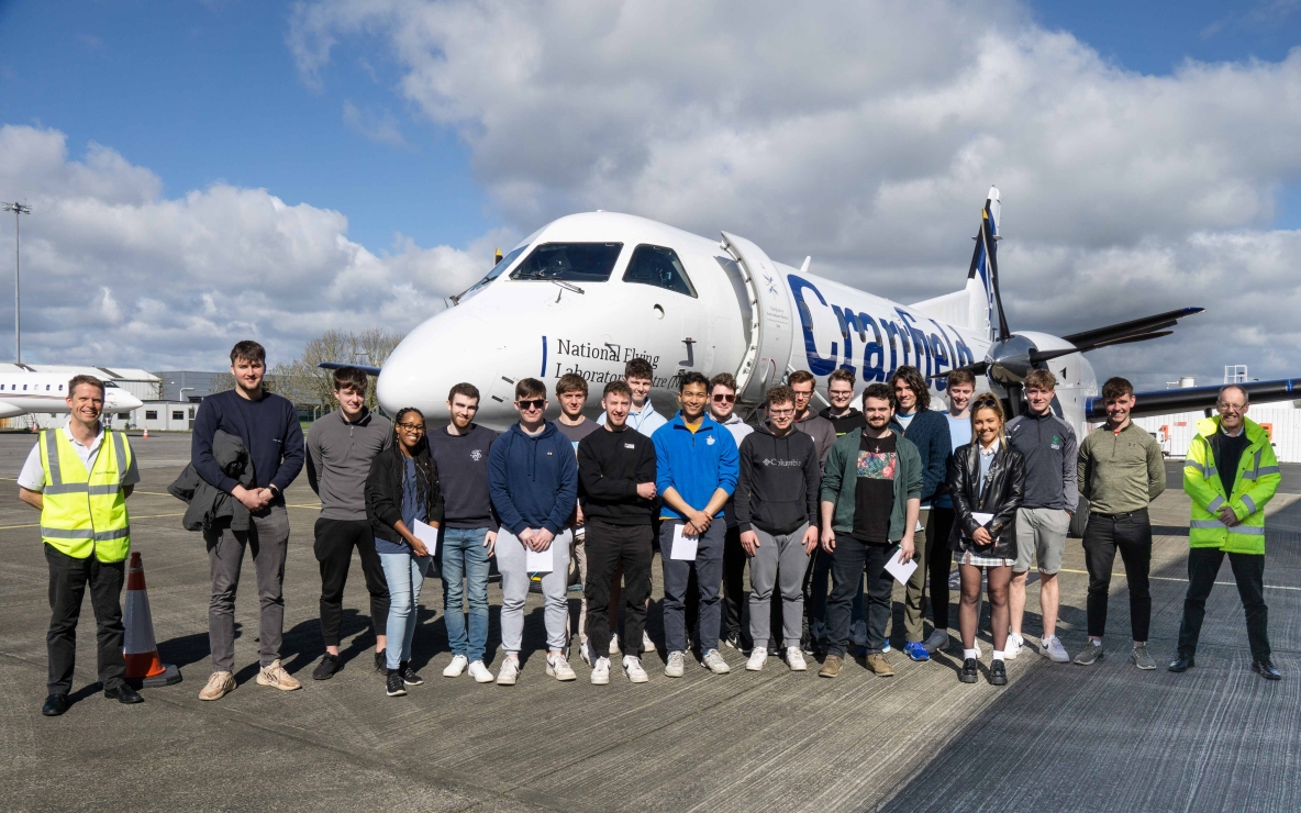 The group of UL students pictured in Shannon with the Flying Classroom plane
