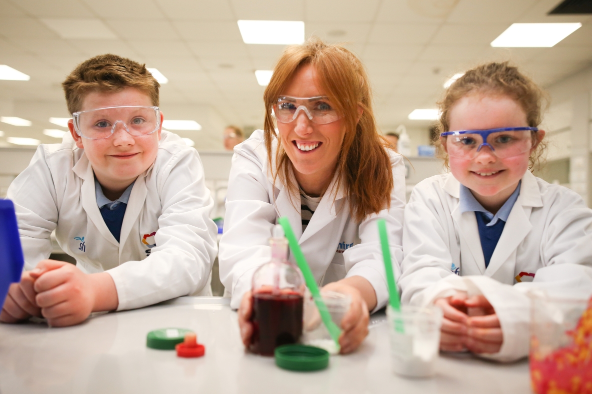 Students from Drumlea National School in Leitrim with STEMtacular founder Louise Gallager pictured taking part in a science workshop at the Department of Chemical Sciences, University of Limerick
