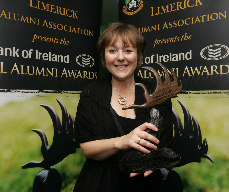Ms Niamh O'Carroll holding her UL Alumni Award